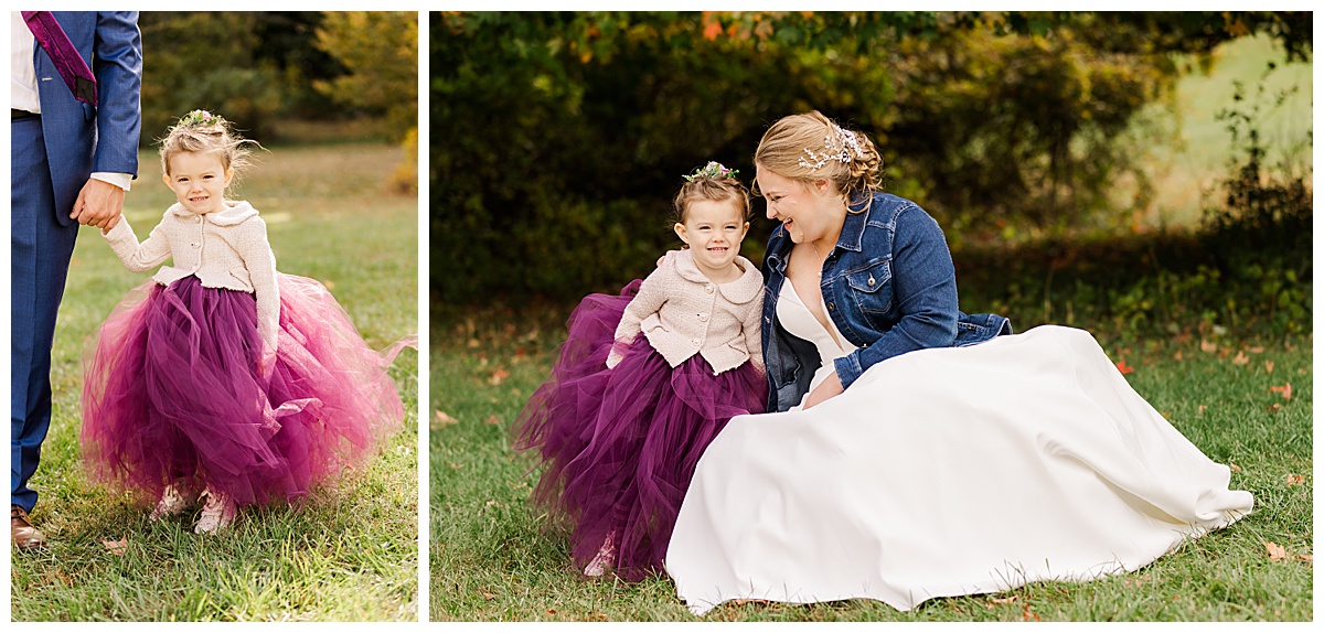 flower girl smiling at the camera while bride looks at her