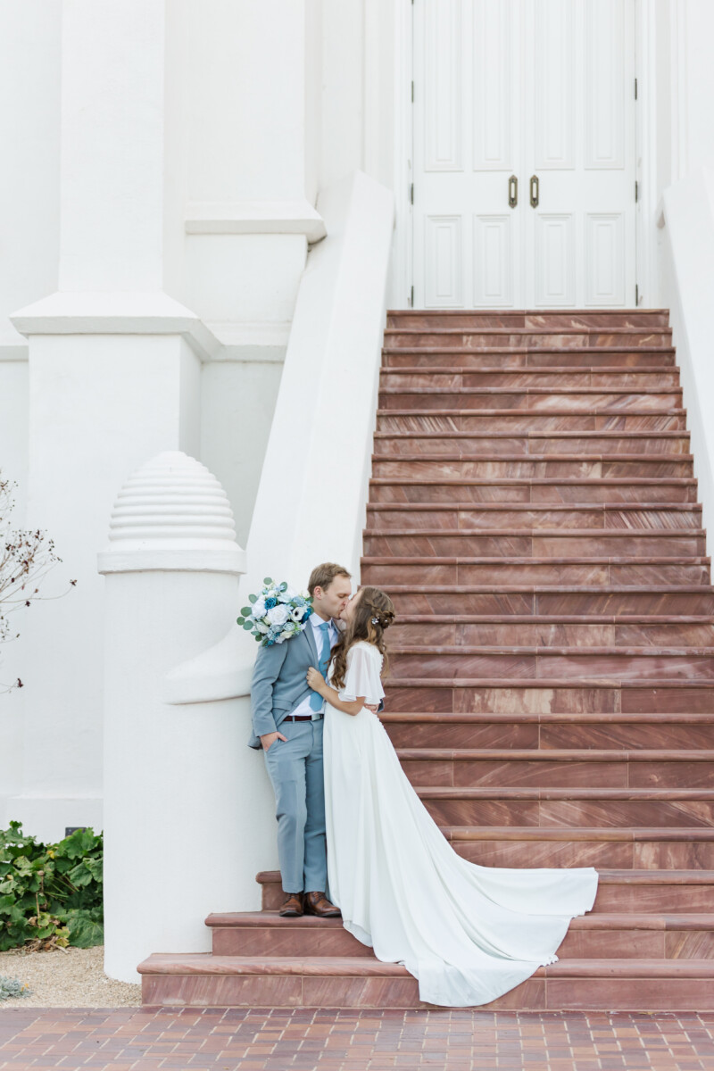 couple kissing in front of the st. george temple