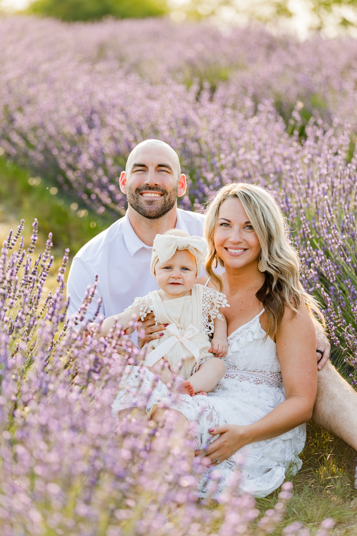 family sitting in a lavender field near chelsea michigan