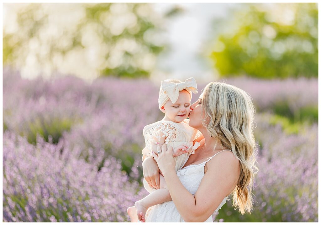 Mom kisses baby on the cheek 