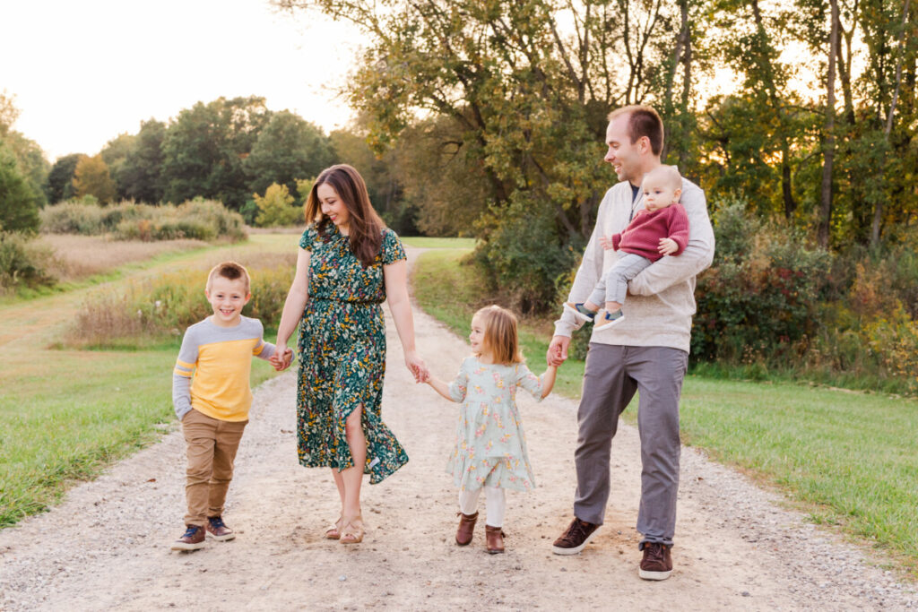 Family of 5 walking on a path at Hudson Mills Metropark.